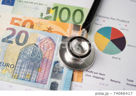 Stethoscope and EU banknotes on chart or graph paper, Financial, account, statistics and business data  medical health concept. 74066417