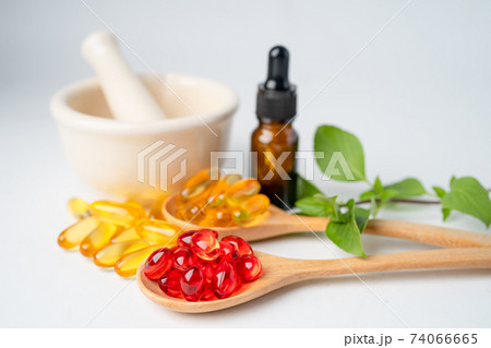 Alternative medicine herbal organic capsule with vitamin E omega 3 fish oil, mineral, drug with herbs leaf natural supplements for healthy good life. 74066665