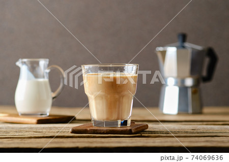 Iced coffee with milk ice cubes 74069636
