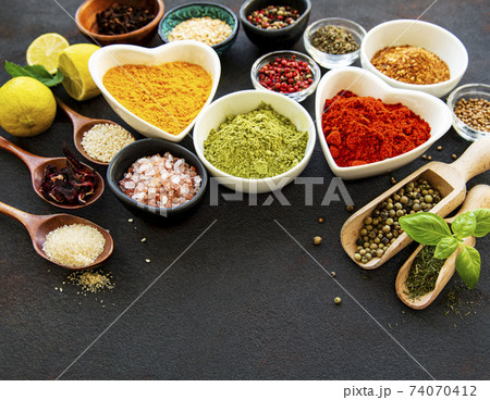 Various spices in a bowls on a black 74070412