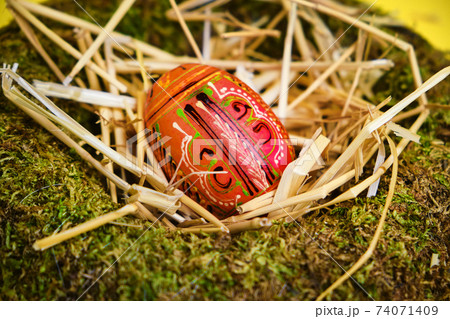 easter basket with easter eggs on Yellow background 74071409