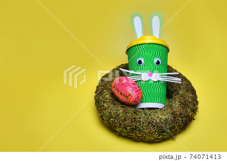 cardboard cup of coffee, with ears and a rabbit face 74071413