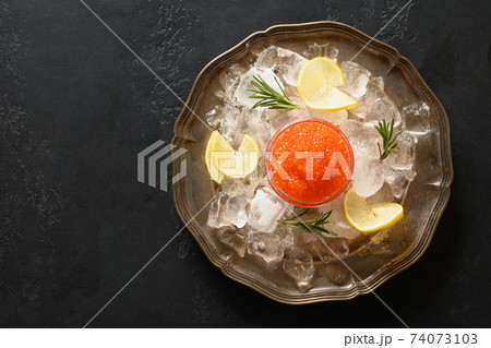 Red caviar in bowl in shape of star for party. Red caviar in bowl in shape of star for party. 74073103
