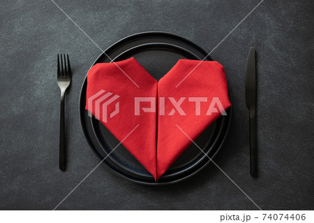 Black plates with cutlery and napkin. Black plates with cutlery and napkin. 74074406