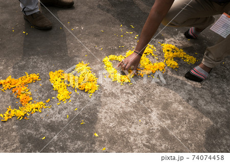 The Word India written with yellow marigold flowers in 26th January on India Republic day celebration. 15th August Independence Day Holiday background concept. High angle view. Close Up. The Word India written with yellow marigold flowers in 26th January on India Republic day celebration. 15th August Independence Day Holiday background concept. High angle view. Close Up. 74074458
