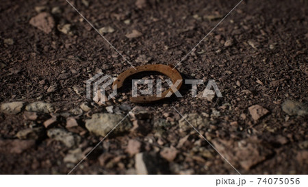 one old rusty metal horseshoe 74075056