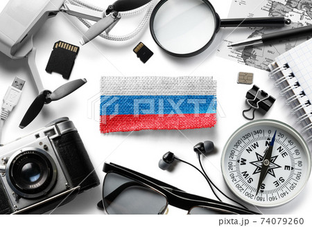 Flag of Russia and travel accessories on a white background. 74079260