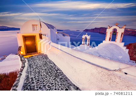 Oia, Santorini - Greek Islands sunrise with traditional church 74081211