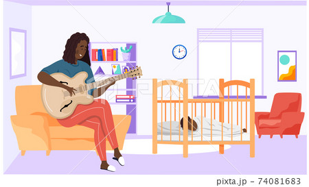 Mom singing lullaby to baby at night and helps him to sleep. Family rest together at home 74081683