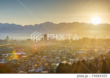 Toyama, Japan downtown city skyline with Tateyama Mountain 74083505