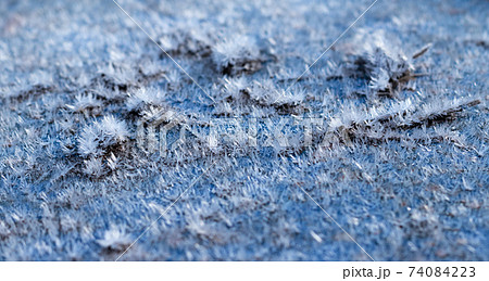 White hoarfrost crystals on flat surface macro view White hoarfrost crystals on flat surface macro view 74084223