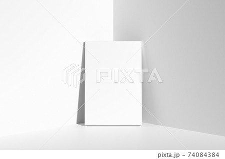 Rectangular poster on floor leaning at walls in corner 74084384