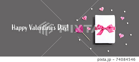 Valentines Day message with a gift box and hearts Valentines Day message with a gift box and hearts 74084546