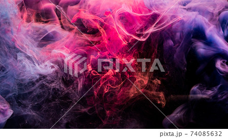 ink in water colorful background fume pink purple 74085632