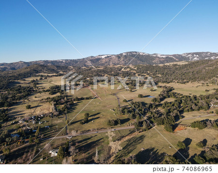 Aerial view of valley with farmland an forest in Julian, California, USA 74086965