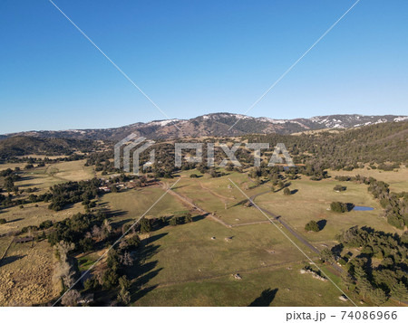 Aerial view of valley with farmland an forest in Julian, California, USA 74086966