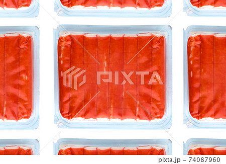 Crab sticks vacuum packed. Crab sticks from the store on a white background. Crab sticks vacuum packed. Crab sticks from the store on a white background. 74087960
