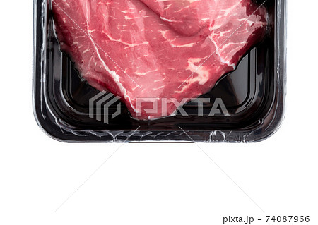 Vacuum-packed beef on a white background. Marbled beef from the store isolated on a white background. Vacuum-packed beef on a white background. Marbled beef from the store isolated on a white background. 74087966