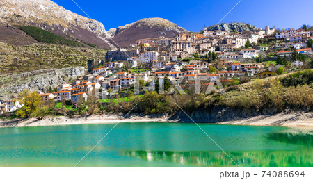 Pictorial emerald lake - Lago di Barrea and medieval village in Abruzzo, Italy 74088694