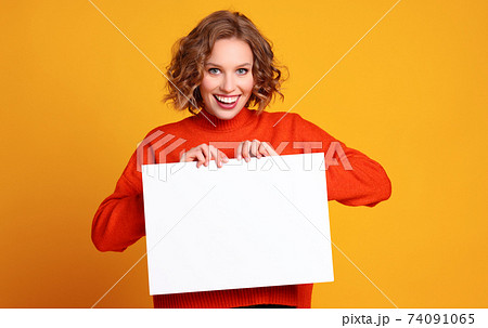 Happy female with blank poster Happy female with blank poster 74091065