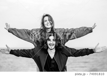 Happy young couple having fun outdoors together 74091810