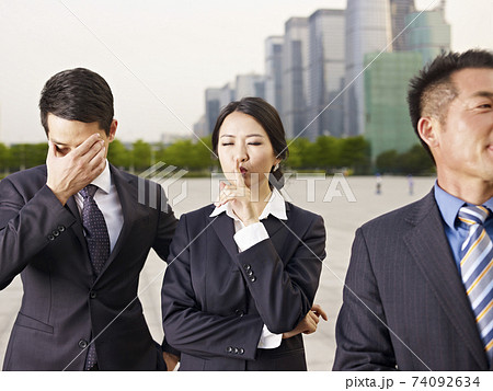 a team of asian businesspeople having fun outdoor 74092634