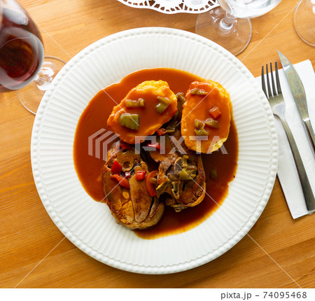 Oven baked lamb with potato and sauce Oven baked lamb with potato and sauce 74095468
