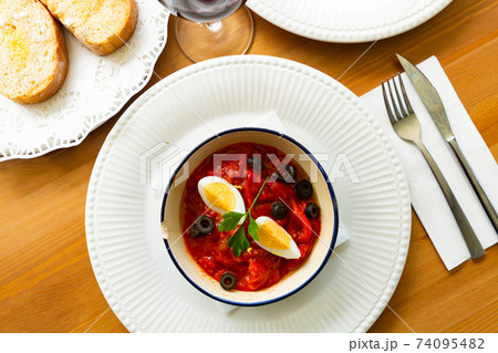 Andalusian roasted pepper salad with boiled egg and olives Andalusian roasted pepper salad with boiled egg and olives 74095482