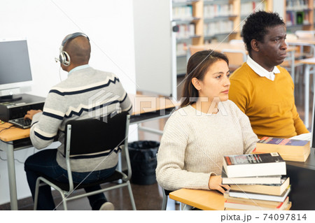 Young adult woman studying in computer class 74097814