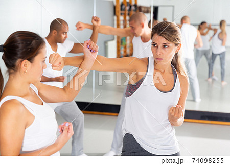 Womens sparring in self defense courses in gym Womens sparring in self defense courses in gym 74098255