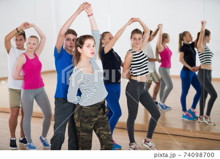 Teenagers studying of partner dance at school 74098700