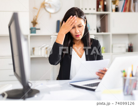 Angry female manager experiencing emotions in office 74099126