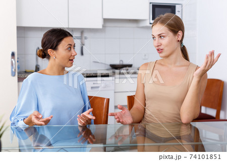 Friends having expressional talking Friends having expressional talking 74101851