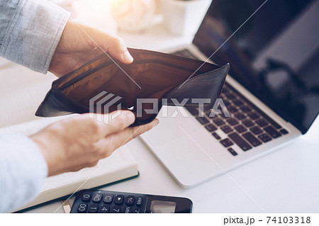 Woman holds an empty purse and coins in hand meaning money financial problem or bankrupt jobless, broke after credit card payday jobless, debt. Woman holds an empty purse and coins in hand meaning money financial problem or bankrupt jobless, broke after credit card payday jobless, debt. 74103318