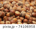 Forest nut background. Full and half of hazelnuts on white background top view. Isolated 74106958