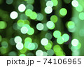 Abstract green bokeh texture on black background 74106965