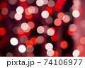 Abstract red bokeh texture on black background 74106977