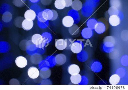 Abstract blue bokeh texture on black background 74106978