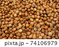 Forest nut background. Full and half of hazelnuts on white background top view. Isolated 74106979