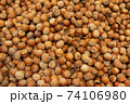 Forest nut background. Full and half of hazelnuts on white background top view. Isolated 74106980