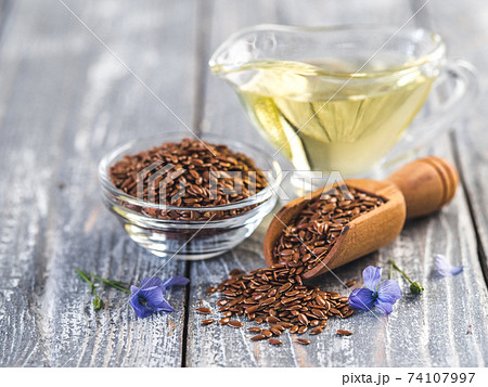 Flax seeds and flaxseed oil with copy space Flax seeds and flaxseed oil with copy space 74107997