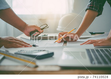 engineer working in office with blueprints, inspection in workplace for architectural plan, construction project ,Business construction. 74110028