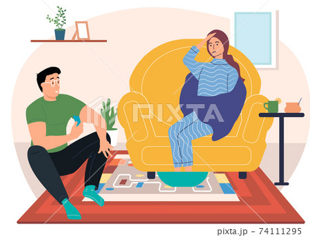 Sick girl take medication on self-isolation. Woman wrapped in plaid warms feet in hot water Sick girl take medication on self-isolation. Woman wrapped in plaid warms feet in hot water 74111295