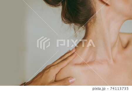 Female hands gently touch the young attractive brunette woman. Female hands gently touch the young attractive brunette woman. 74113735