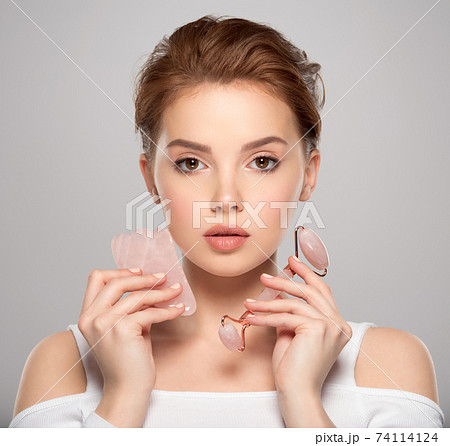 Beautiful face of young caucasian woman with perfect healthy skin, isolated. Pretty white model caring of face. Beauty treatment concept. Skin care concept. Beautiful face of young caucasian woman with perfect healthy skin, isolated. Pretty white model caring of face. Beauty treatment concept. Skin care concept. 74114124