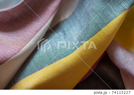 Crumpled multi colored striped fabric textile background Crumpled multi colored striped fabric textile background 74115227
