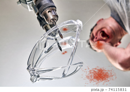 Worker sustained an eye injury while drilling mirror. 74115831