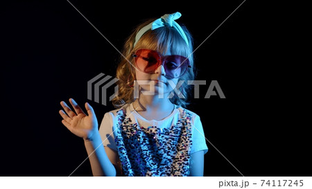 Futuristic hipster teen girl waving hand, hello, hi, welcome, bye, greetings at disco cyberpunk club Futuristic hipster teen girl waving hand, hello, hi, welcome, bye, greetings at disco cyberpunk club 74117245
