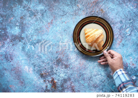fresh baked croissant on plate with copy space fresh baked croissant on plate with copy space 74119283