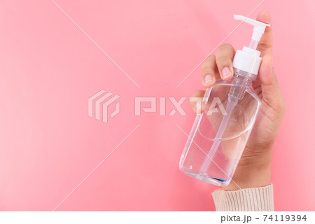 women hand using sanitizer gel for preventing virus with copy space women hand using sanitizer gel for preventing virus with copy space 74119394